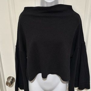 Stylish women’s XS oversized waffle knit top with wide sleeves. Black.